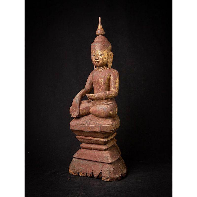 Material: wood
61 cm high 
23 cm wide and 17,8 cm deep
Weight: 4.346 kgs
Gilded with 24 krt. gold
Shan (Tai Yai) style
Bhumisparsha mudra
Originating from Burma
18th century

