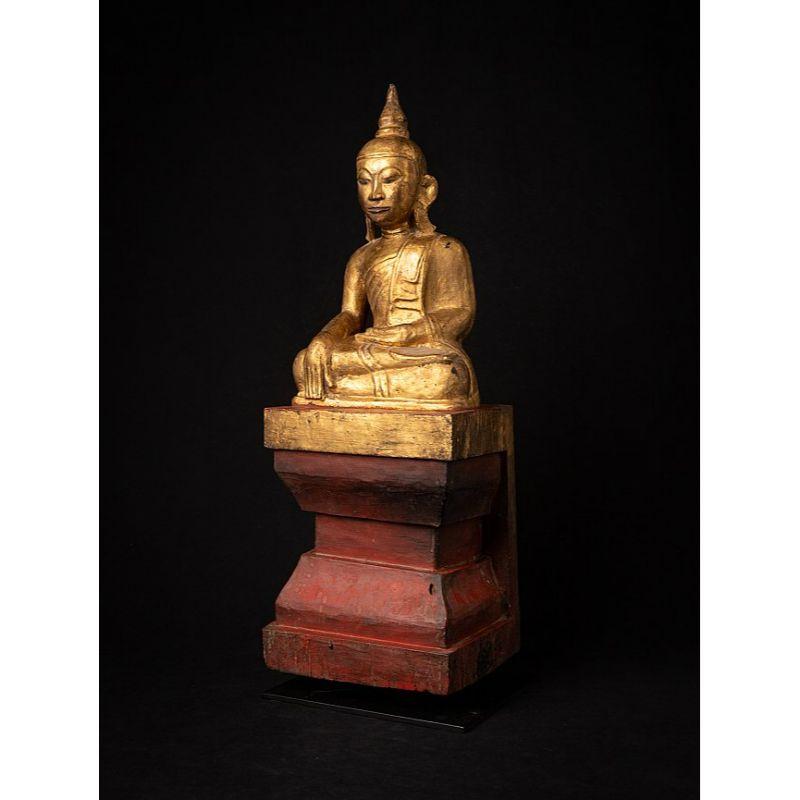 Material: wood
62,5 cm high 
22,1 cm wide and 19 cm deep
Weight: 8.25 kgs
Gilded with 24 krt. gold
Bhumisparsha mudra
Originating from Burma
19th century

