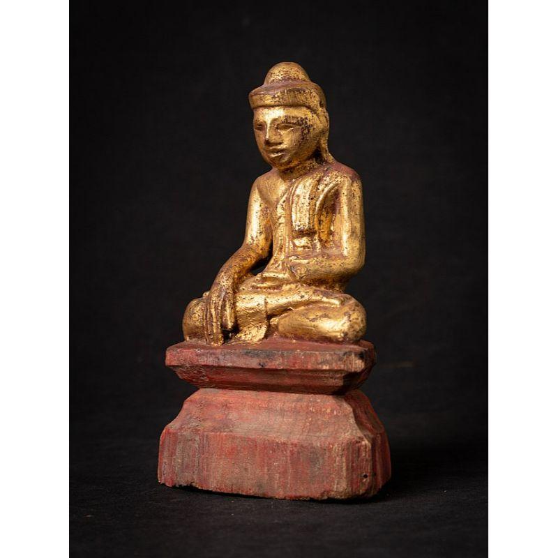 Material: wood
18,4 cm high 
10,4 cm wide and 6,5 cm deep
Weight: 0.173 kgs
Gilded with 24 krt. gold
Mandalay style
Bhumisparsha mudra
Originating from Burma
19th century
