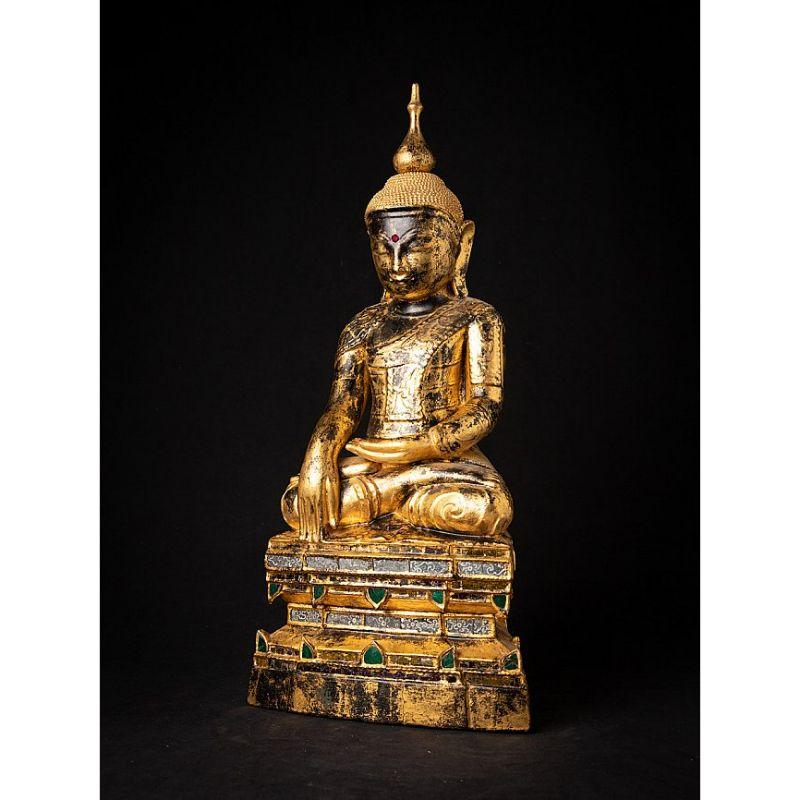 Material: wood
60 cm high 
27,6 cm wide and 17,5 cm deep
Weight: 4.638 kgs
Gilded with 24 krt. gold
Shan (Tai Yai) style
Bhumisparsha mudra
Originating from Burma
18th century
Beautiful quality !.


