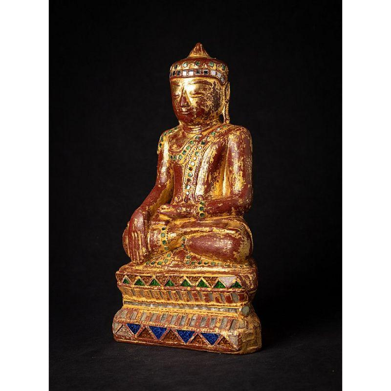Material: wood
35,7 cm high 
20 cm wide and 12,5 cm deep
Weight: 2.394 kgs
Gilded with 24 krt. gold
Shan (Tai Yai) style
Bhumisparsha mudra
Originating from Burma
19th century

