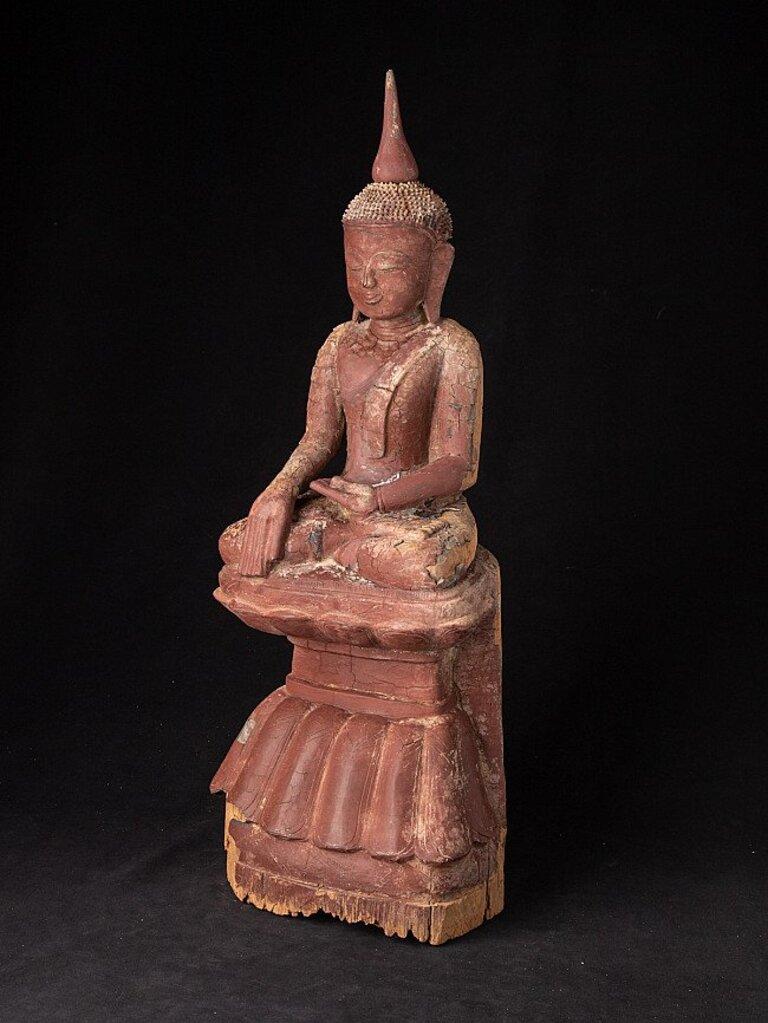 Material: wood
69,5 cm high 
25,2 cm wide and 19 cm deep
Weight: 7.4 kgs
With a few traces of the original gilding
Shan (Tai Yai) style
Bhumisparsha mudra
Originating from Burma
17th century
 