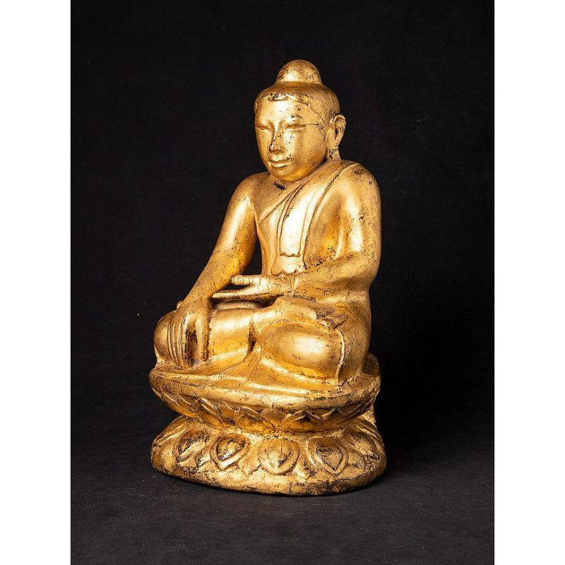 Material: wood
35,7 cm high 
21 cm wide and 18,5 cm deep
Weight: 2.584 kgs
Gilded with 24 krt. gold
Shan (Tai Yai) style
Bhumisparsha mudra
Originating from Burma
18th century.

