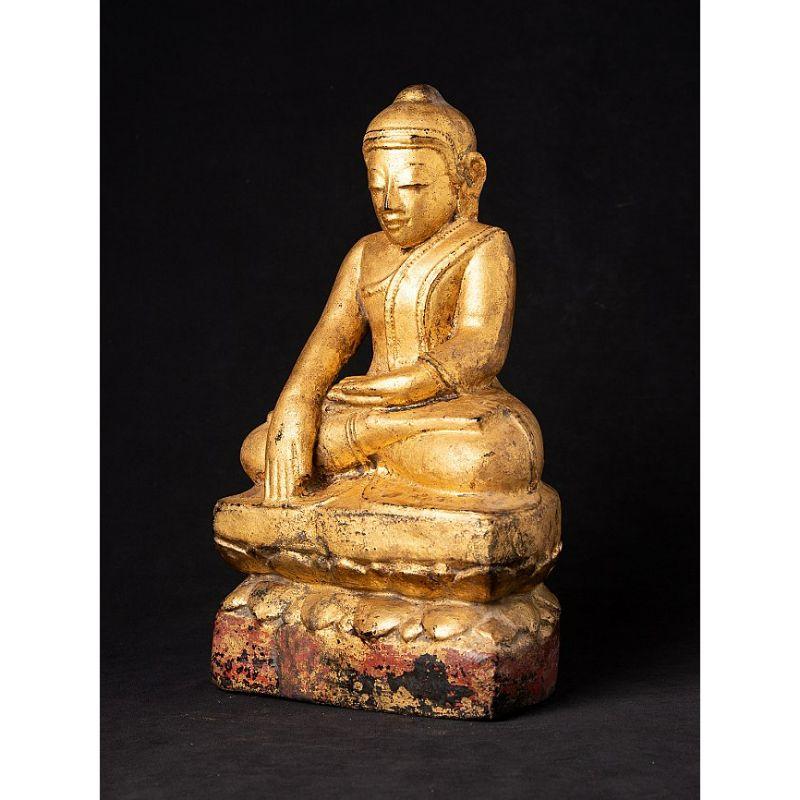 Material: wood
Measures: 33,9 cm high 
19,4 cm wide and 13,4 cm deep
Weight: 2.272 kgs
Gilded with 24 krt. gold
Bhumisparsha mudra
Originating from Burma
Early 19th century

