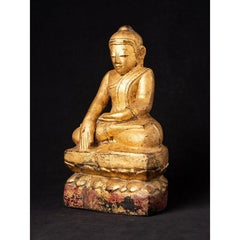 Antica statua di Buddha birmano in legno proveniente dalla Birmania