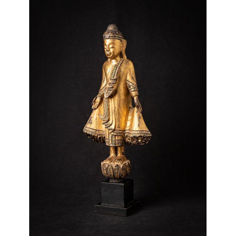 Material: wood
55 cm high 
23 cm wide and 10,3 cm deep
Weight: 1.394 kgs
Gilded with 24 krt. gold
Mandalay style
Originating from Burma
19th century

