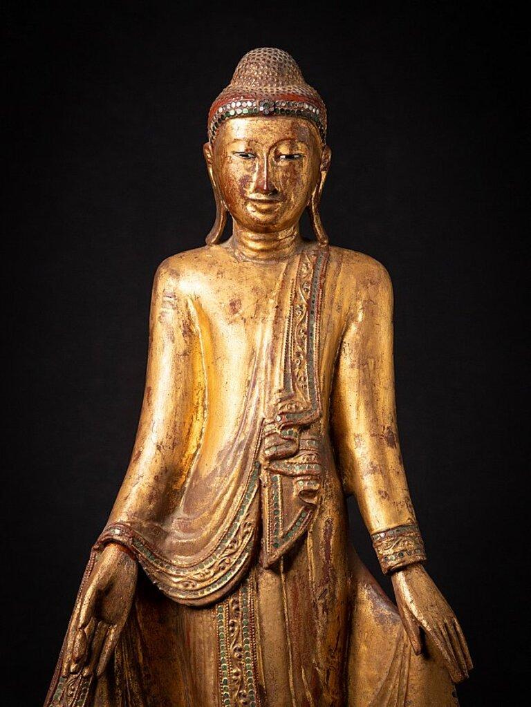 Material: wood
87 cm high 
39 cm wide and 24 cm deep
Weight: 7.25 kgs
Gilded with 24 krt. gold
Mandalay style
Originating from Burma
19th century
With inlayed eyes.
 
