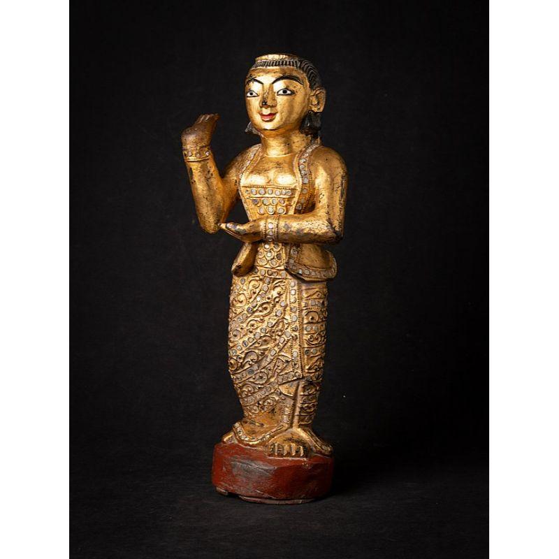 Material: wood
46,5 cm high 
18 cm wide and 13,5 cm deep
Weight: 2.185 kgs
Gilded with 24 krt. gold
Mandalay style
Originating from Burma
19th century


