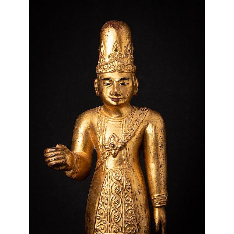 Material: wood
58,5 cm high 
20 cm wide and 23 cm deep
Weight: 3.306 kgs
Gilded with 24 krt. gold
Originating from Burma
19th century
With inlayed eyes

