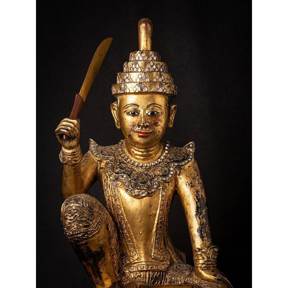 Material: wood
Measures: 60,8 cm high 
34,5 cm wide and 26,3 cm deep
Weight: 8.977 kgs
Gilded with 24 krt. gold
Mandalay style
Originating from Burma
19th century
With inlayed eyes.






