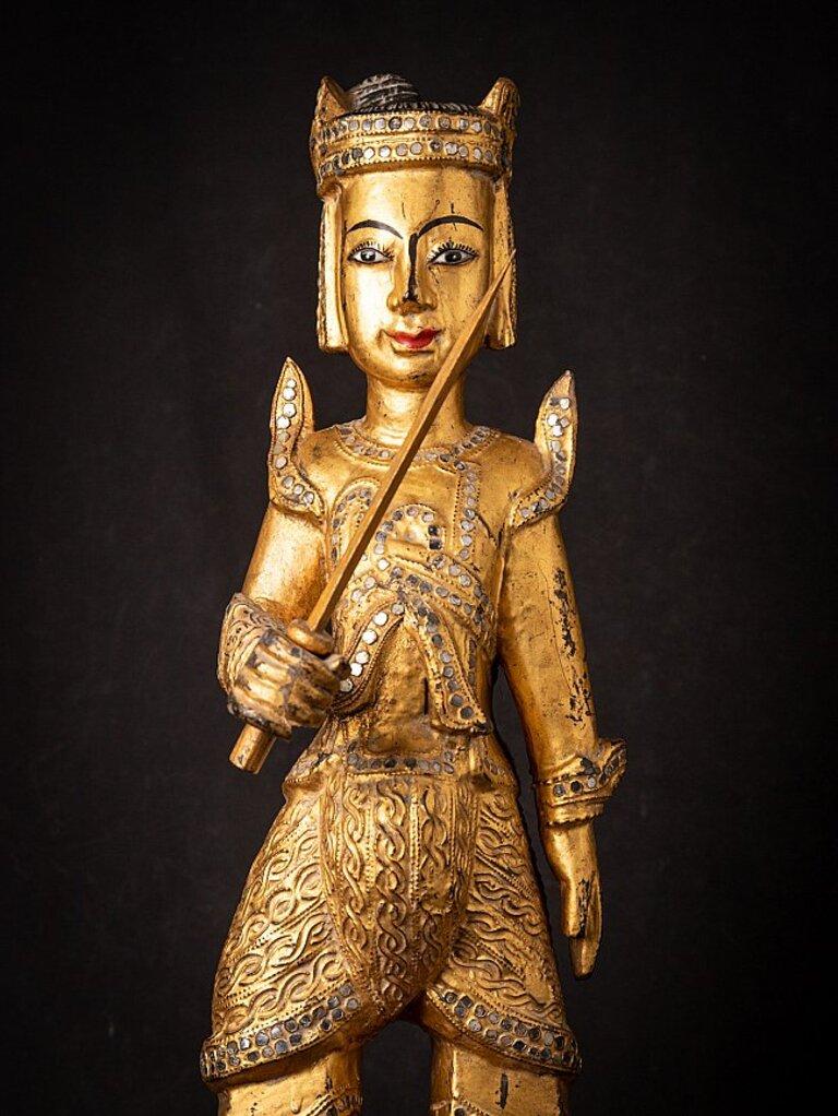 Material: wood
69,7 cm high 
22,5 cm wide and 21 cm deep
Weight: 4.524 kgs
Gilded with 24 krt. gold
Mandalay style
Originating from Burma
19th century.
 
