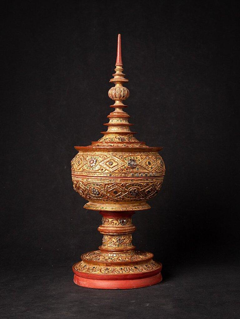 Material: wood
50 cm high 
19,2 cm diameter
Weight: 1.465 kgs
Gilded with 24 krt. gold
Mandalay style
Originating from Burma
19th century.
 