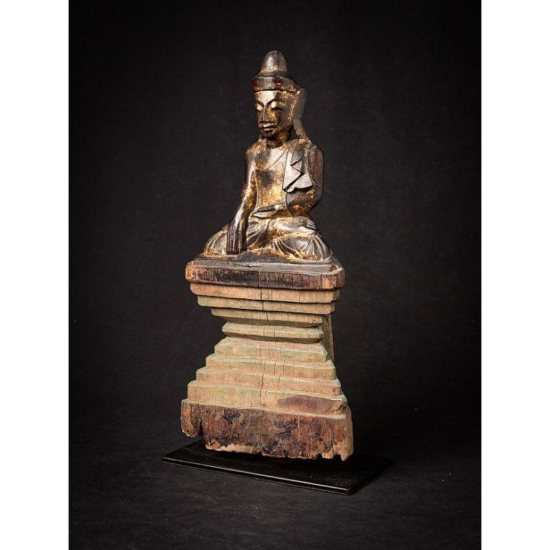 Material: wood
41,8 cm high 
20,5 cm wide and 12,3 cm deep
Weight: 2.215 kgs
With traces of 24 krt. gilding
Shan (Tai Yai) style
Bhumisparsha mudra
Originating from Burma
19th century.
 