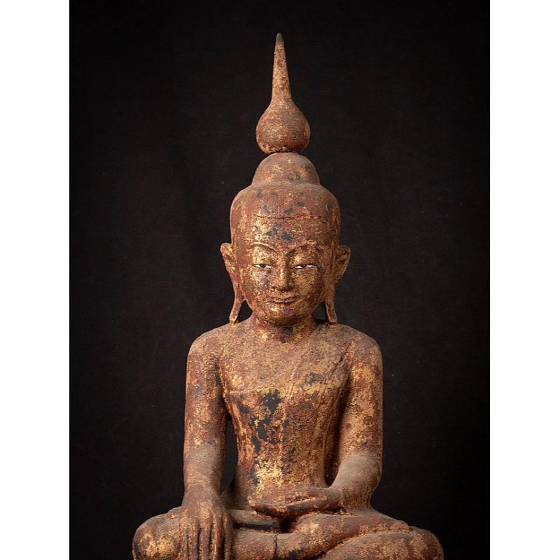 Material: wood
70,5 cm high 
32,5 cm wide and 25 cm deep
Weight: 8.265 kgs
With traces of 24 krt. gilding
Shan (Tai Yai) style
Bhumisparsha mudra
Originating from Burma
Early 20th century

