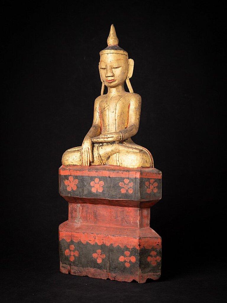 Material: wood
51,7 cm high 
24,2 cm wide and 11,6 cm deep
Weight: 2.408 kgs
Gilded with 24 krt. gold
Shan (Tai Yai) style
Bhumisparsha mudra
Originating from Burma
18th century.
 