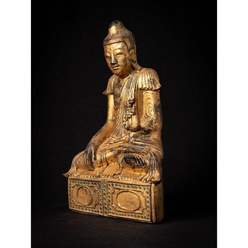 Material: wood
28,7 cm high 
18,5 cm wide and 9,5 cm deep
Weight: 0.929 kgs
Gilded with 24 krt. gold
Shan (Tai Yai) style
Bhumisparsha mudra
Originating from Burma
19th century
A very beautiful piece!.


