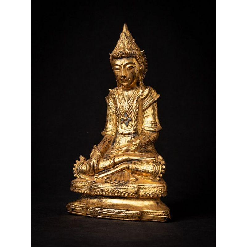 Material: wood
30 cm high 
17,5 cm wide and 9,3 cm deep
Weight: 0.740 kgs
Gilded with 24 krt. gold
Shan (Tai Yai) style
Bhumisparsha mudra
Originating from Burma
19th century

