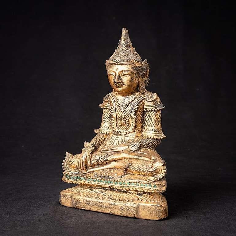Material: wood
30,5 cm high 
15,5 cm wide and 8,3 cm deep
Weight: 0.708 kgs
Gilded with 24 krt. gold
Shan (Tai Yai) style
Bhumisparsha mudra
Originating from Burma
19th Century.