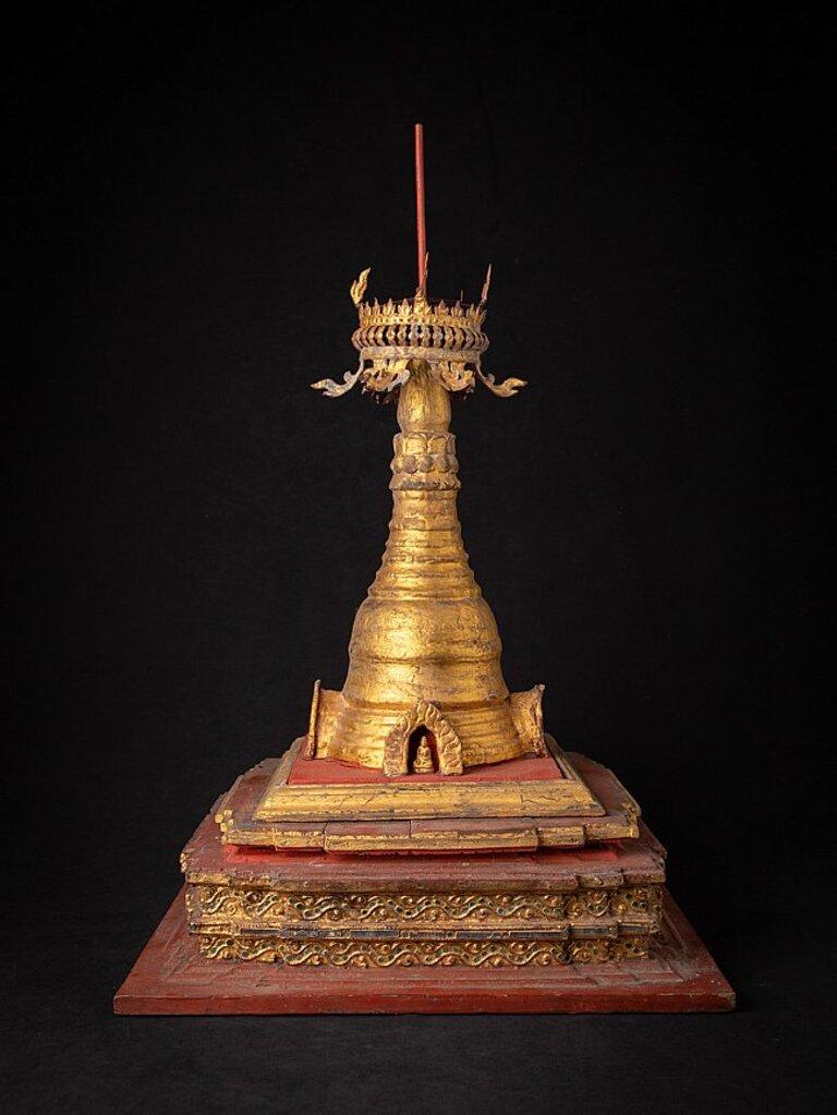 Material: wood
74 cm high 
42,7 cm wide and 42,7 cm deep
Weight: 7.35 kgs
Gilded with 24 krt. gold
Originating from Burma
19th century
With Buddha statues in the openings
Special !
 