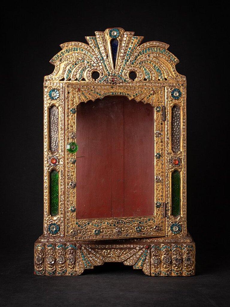 Material: wood
58,7 cm high 
38,5 cm wide and 22 cm deep
Weight: 5.6 kgs
Gilded with 24 krt. gold
Mandalay style
Originating from Burma
Late 19th century.
 