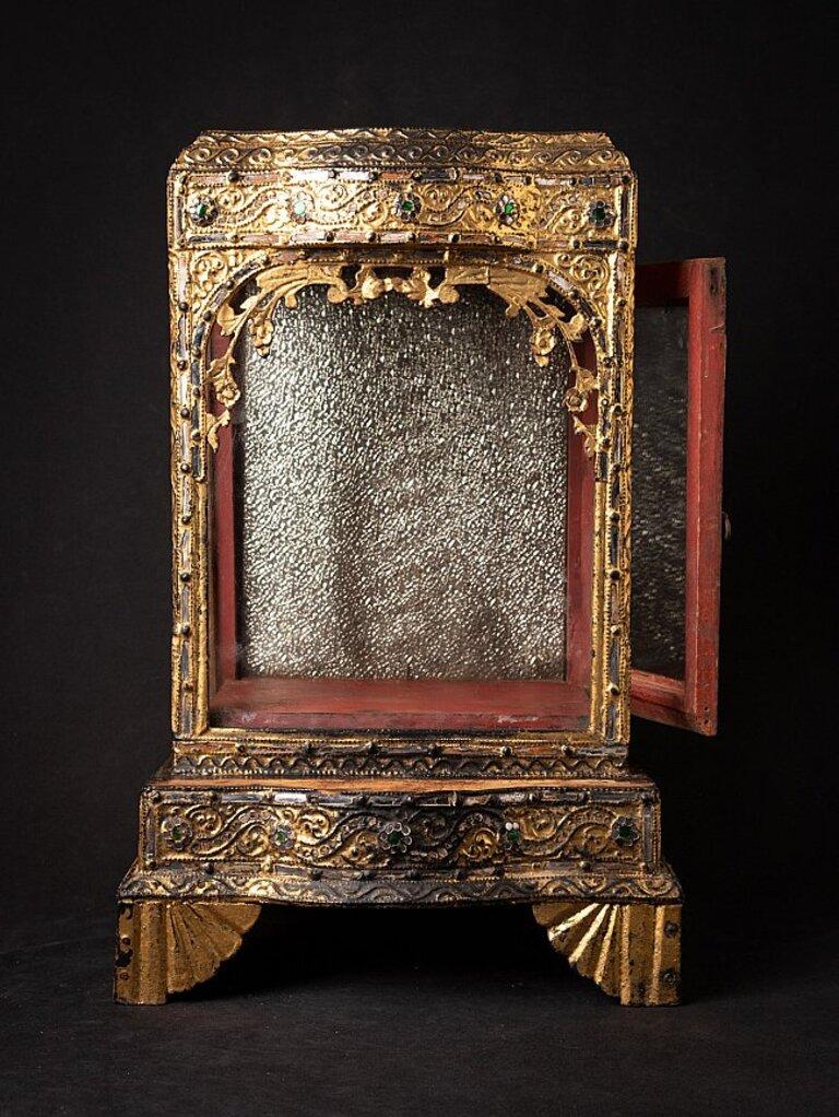 Material: wood
53,2 cm high 
34,2 cm wide and 28,3 cm deep
Weight: 5.383 kgs
Gilded with 24 krt. gold
Mandalay style
Originating from Burma
19th century
