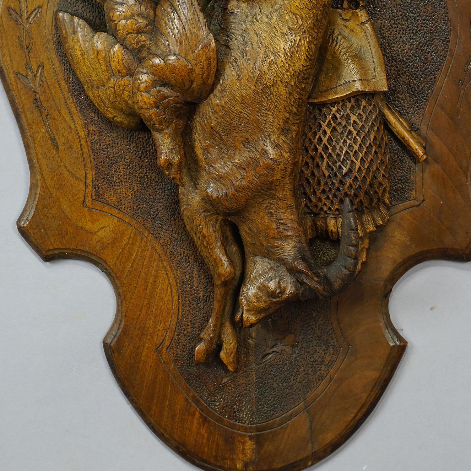 An antique wooden hunting game plaque with impressive carving of a ibex and partridge. Black Forest, executed circa 1900. Ibex Horn restored.

Measures: Width 14.17