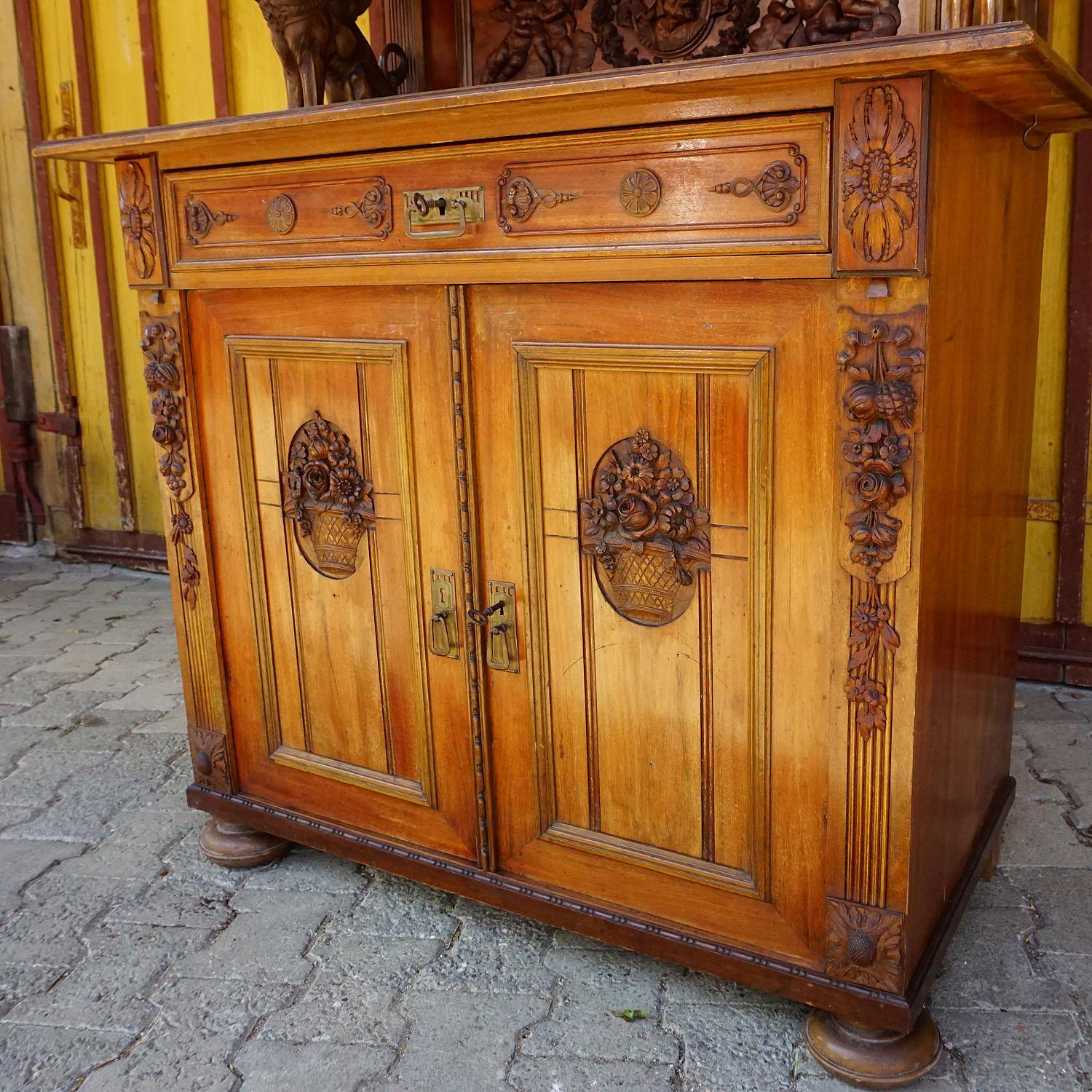 Black Forest Antique Wooden Carved Cupboard with Several Carvings For Sale
