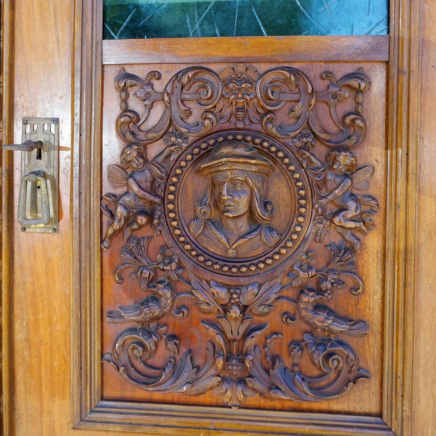 Hand-Carved Antique Wooden Carved Cupboard with Several Carvings For Sale
