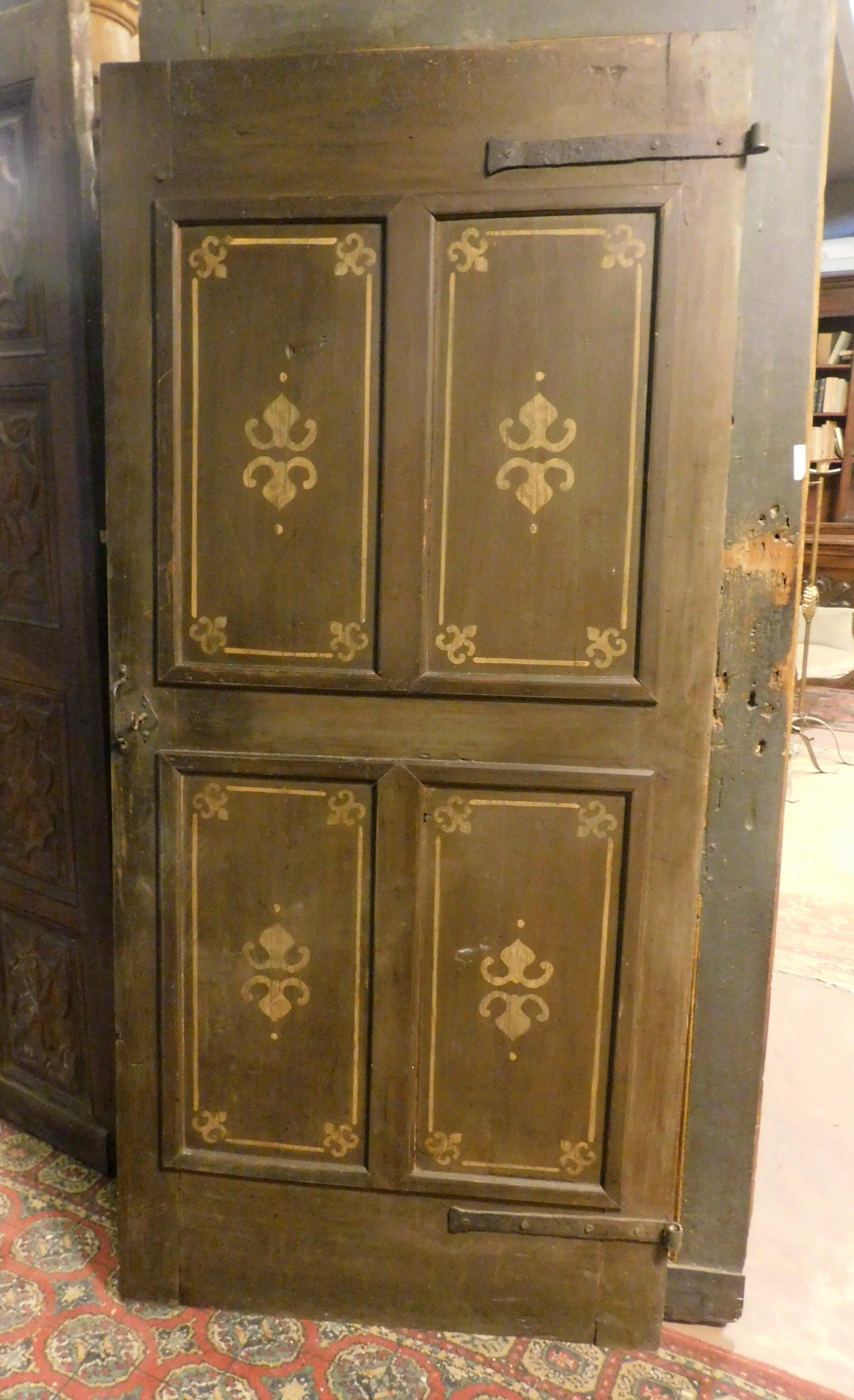 Ancient solid wood door, dark green background with 4 painted panels, mainly rustic style, 19th century, from a home in Italy.
Very fascinating for colors and patina, it still has original irons and is also lacquered on the back, opening to pull to