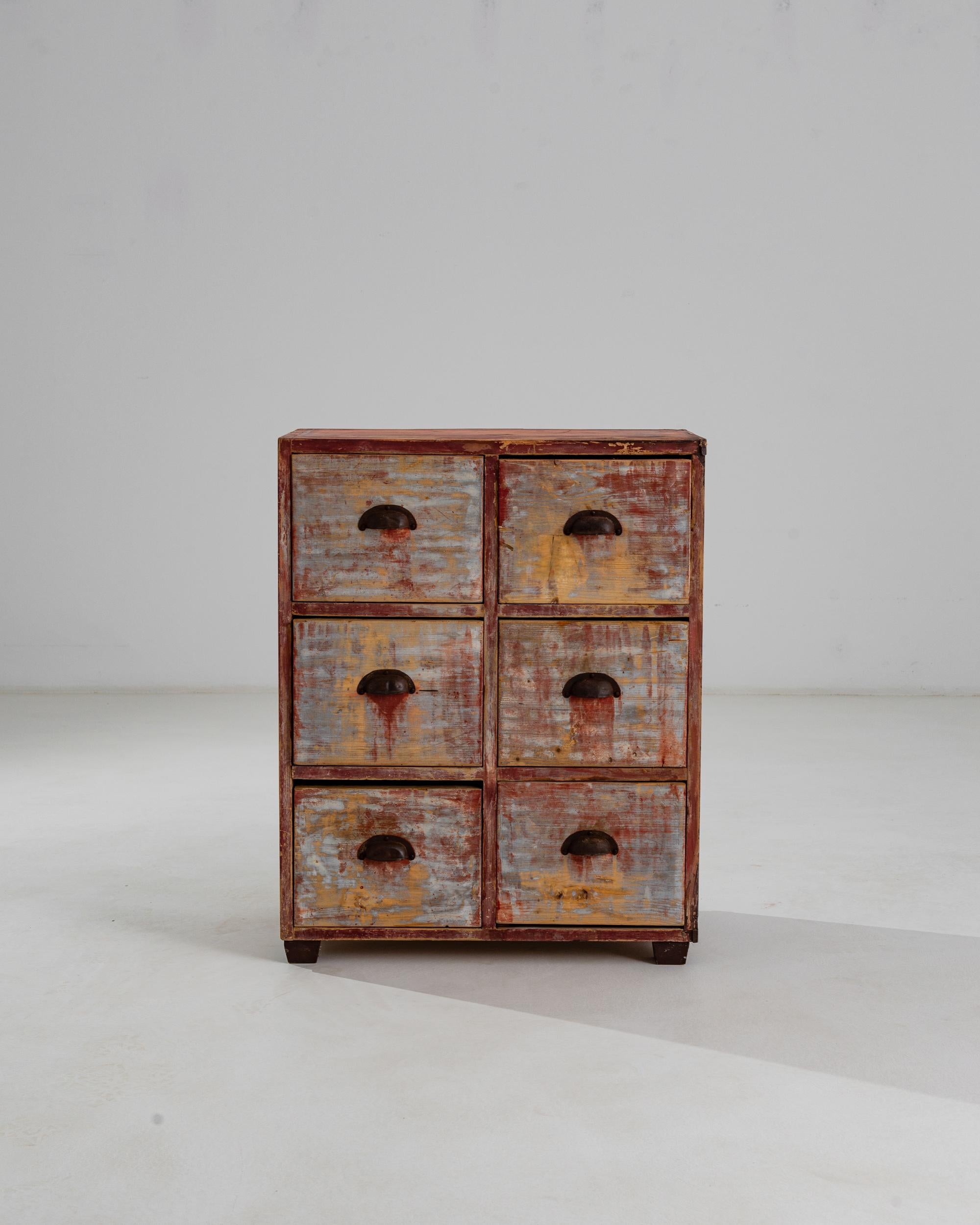 An attractive patina gives this utilitarian six-drawer chest a sweet, nostalgic character. Made in Central Europe in the early 20th Century, the deep square shape of the drawers indicates that this piece was once likely used for filing papers in a