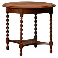 Antico tavolino inglese in legno con gambe in paglia e tornite, XIX secolo.