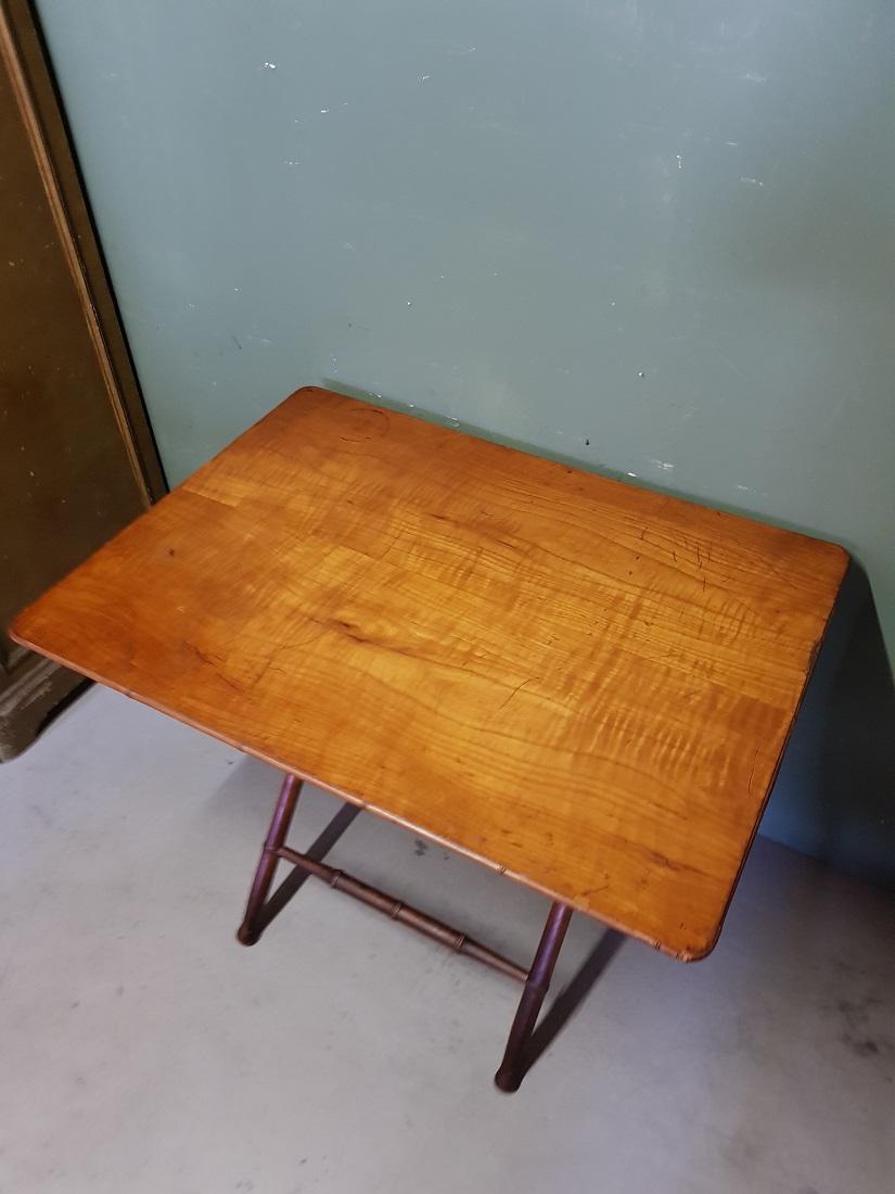 Antique wooden Faux Bamboo folding table with cherry wood top, furthermore in a sturdy condition only the top has some traces of user marks. Originating from the end of the 19th century.

The measurements are,
Depth 64.5 cm/ 25.3 inch.
Width