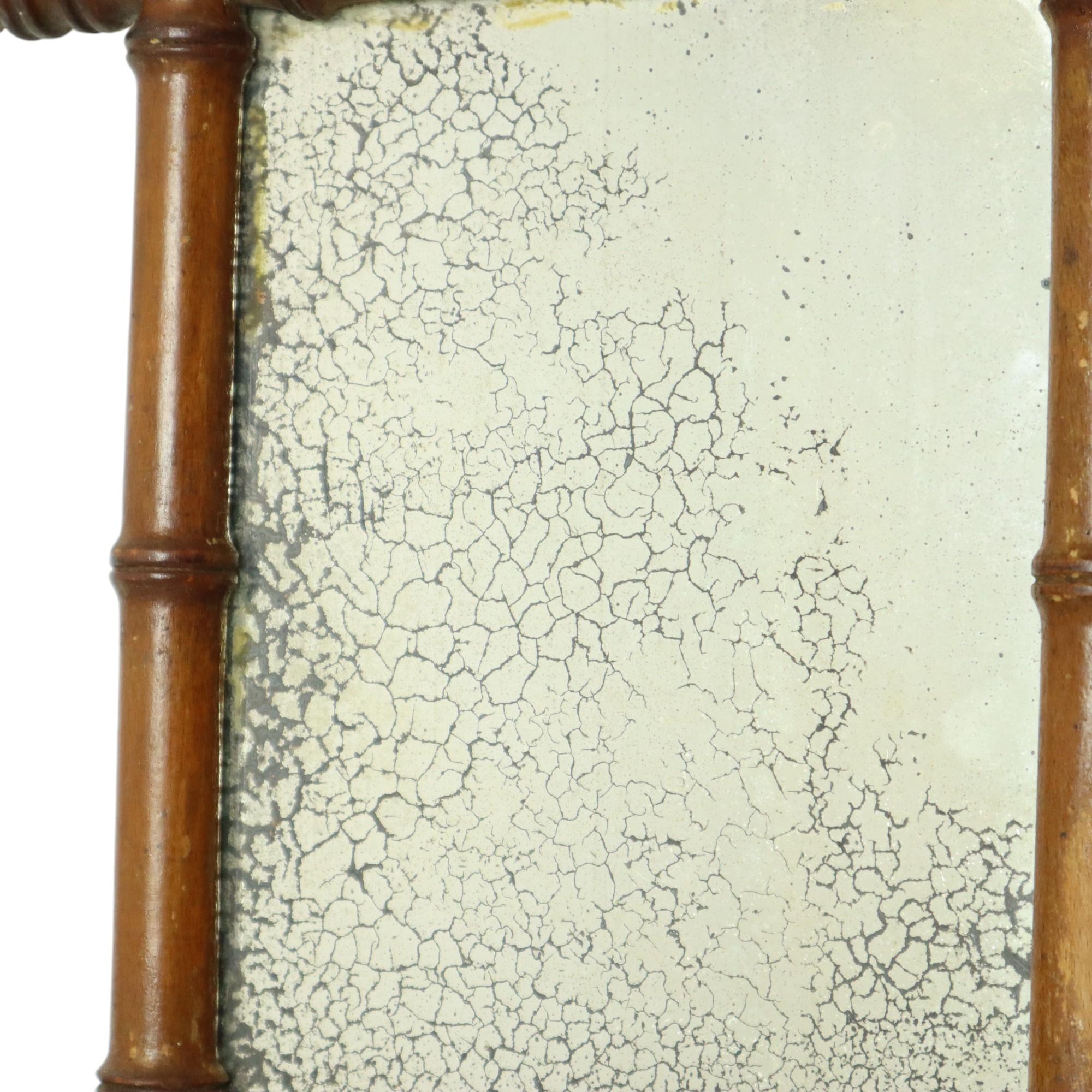 Antique faux bamboo mirror with original backing and wooden back, entirely in Chinoiserie style. This style was very popular during the Art Nouveau period, originating from France. This example dates from around the end of the 19th century.

This