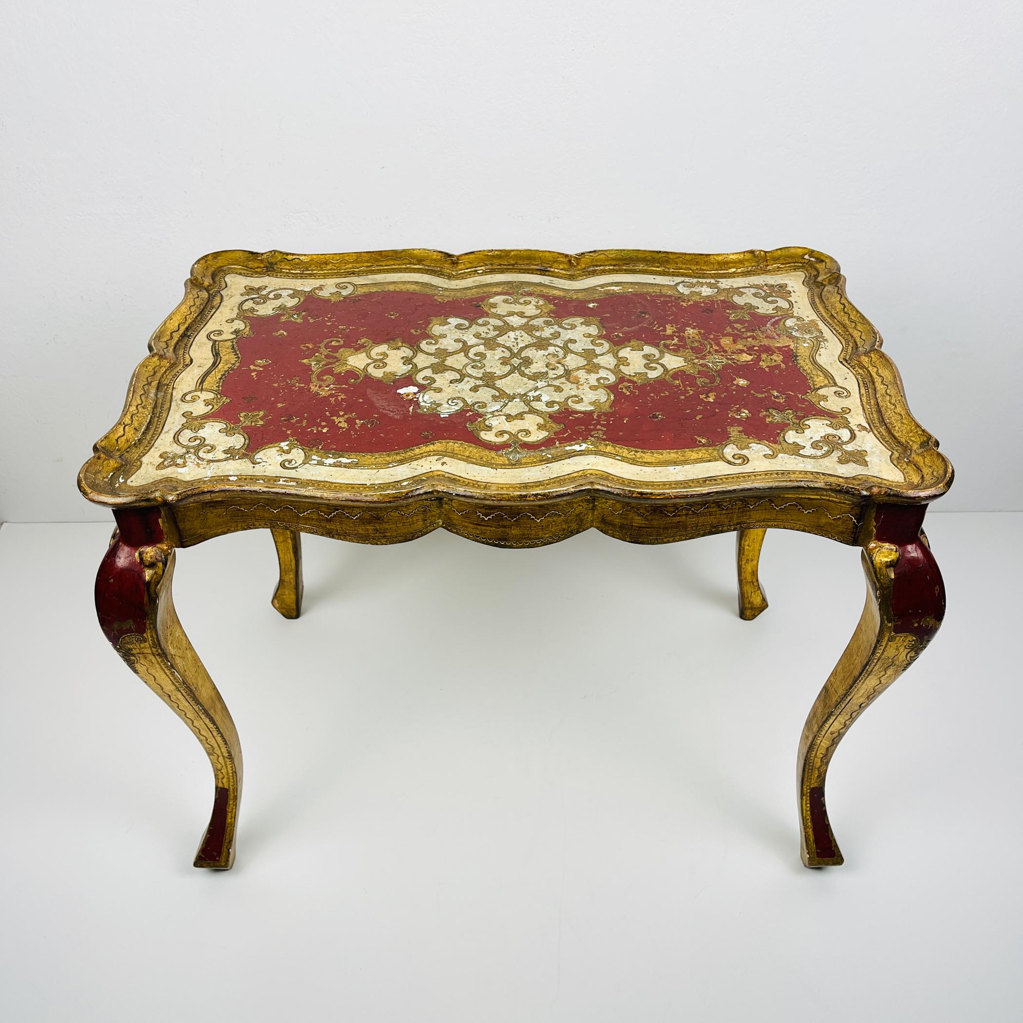 Decorated small Florentine side table style of Hollywood Recency made in Italy 1950s. The coffee table is in very good vintage condition, with traces of time and use. Dimensions: Width: 55 cm / 21,6 inches Height: 42 cm / 16,5 inches Depth: 35 cm /