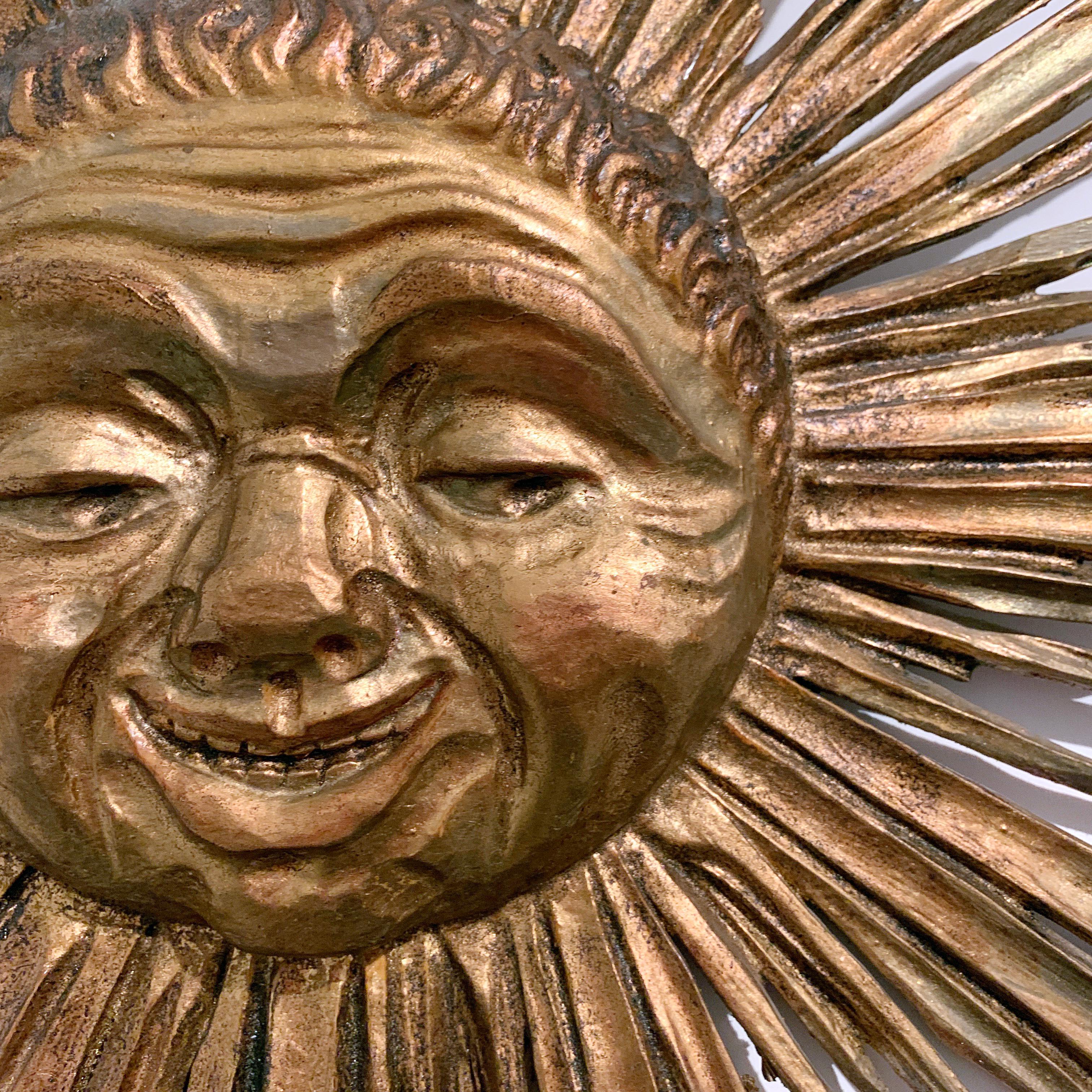 Enigmatic faced carved wooden sunburst face,
1900s
This fabulous gilt wooden sunburst is very unusual and rare, possibly a religious piece originally housed in a church
Beautifully hand carved fine sun rays and facial details, just superb
There