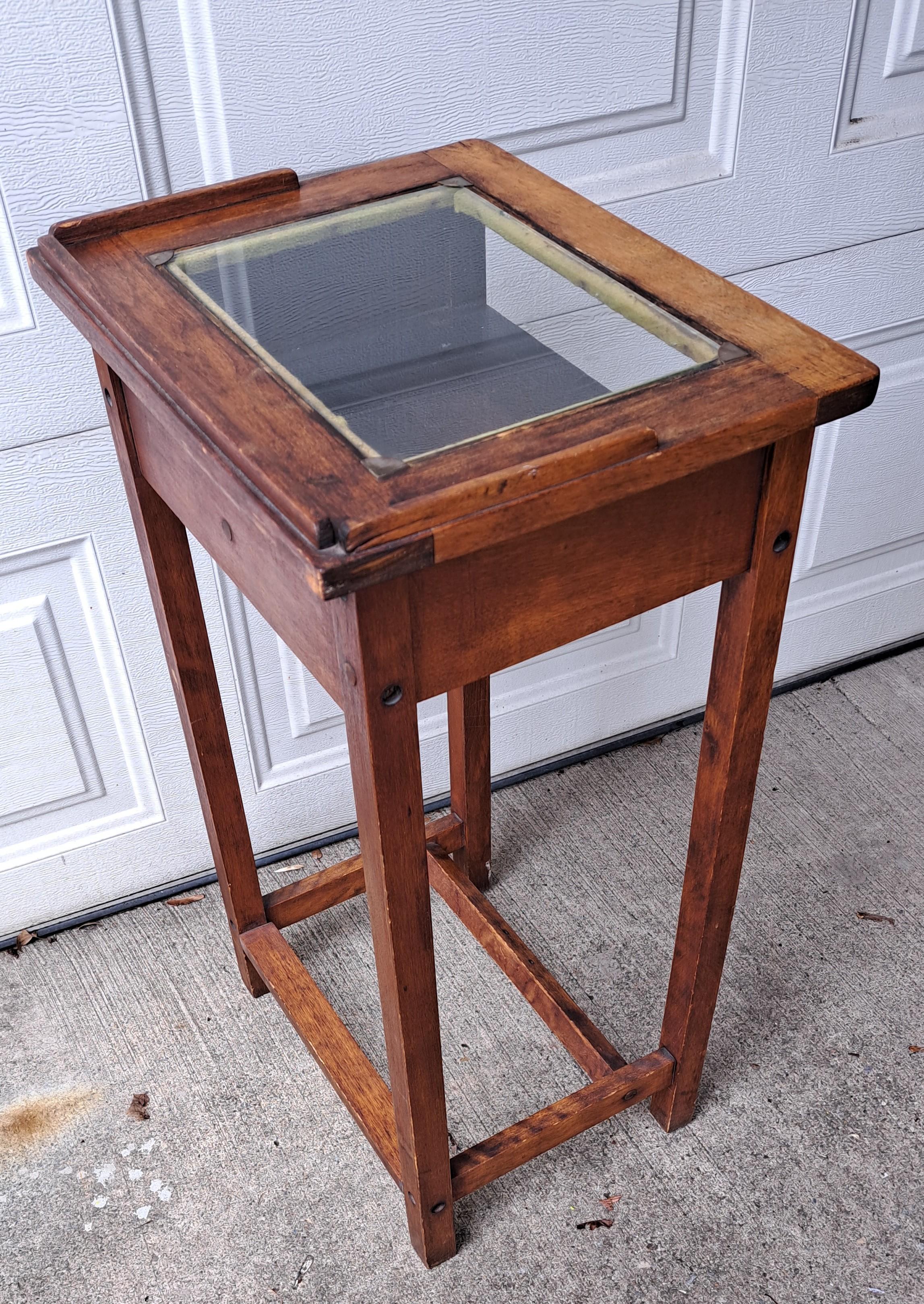 Antique authentic wooden wash stand. Top has three sided ledge and glass insert with brass corners. Original wood has a fine patina.