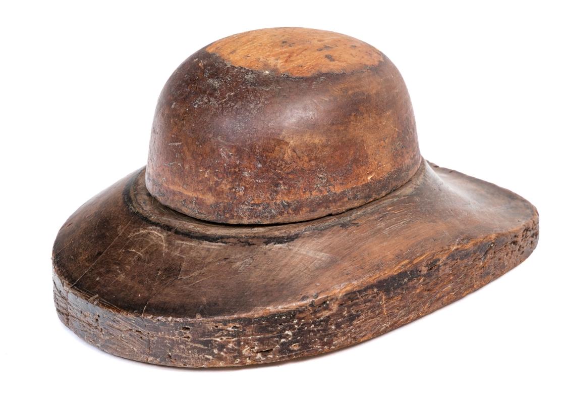 Made in two parts with a broad thick brim. Several marks including W. Plant & Son, Rochdale Road (location of plant from 1850 to 1947) Manchester, 6 Happ St. and numbers 27 and 25 (partially illegible).

Condition: well worn overall with stable age