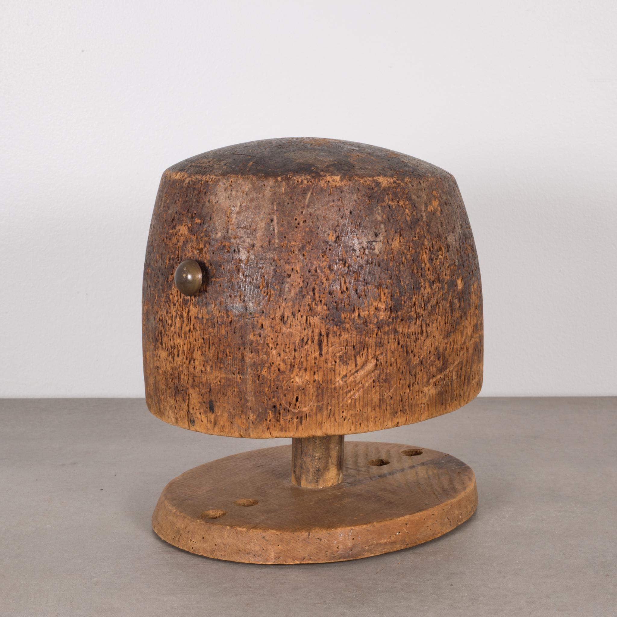 This is an original wooden hat mold/millinery hat mold and is removable from the base. This piece has retained its original finish and has the appropriate patina consistent with age and use.

Creator Unknown.
Date of manufacture circa