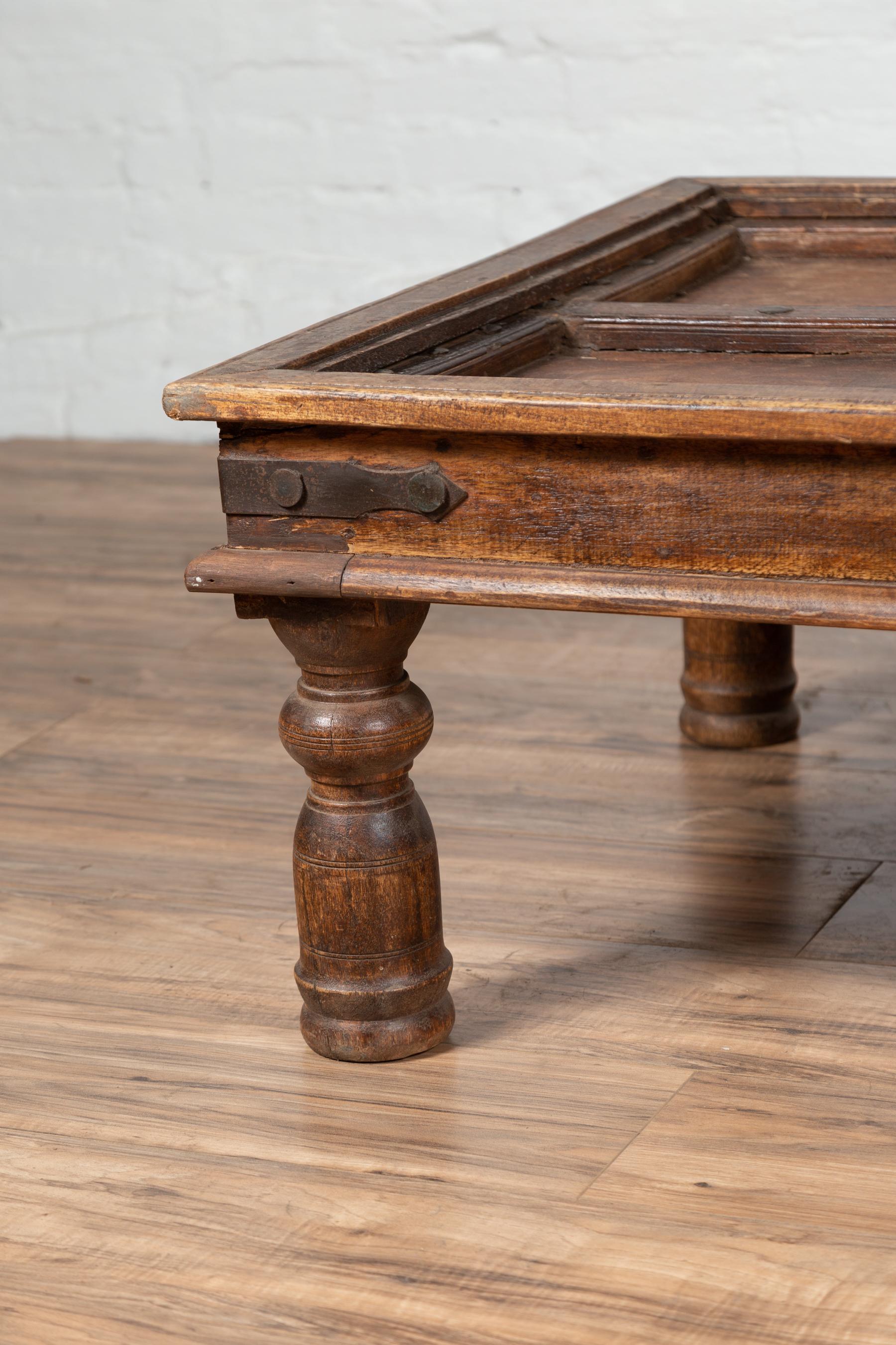 20th Century Antique Wooden Indian Palace Door Made into a Coffee Table with Iron Braces