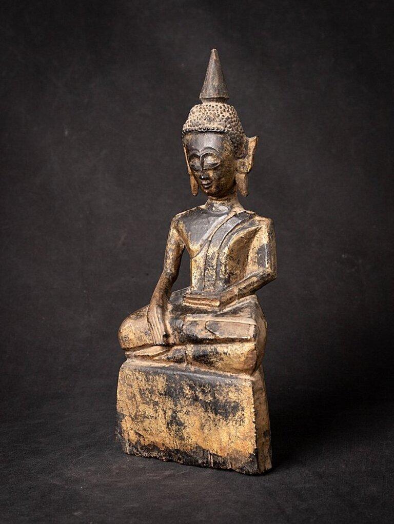 Material: wood
31 cm high 
13,3 cm wide and 7,9 cm deep
Weight: 0.610 kgs
Gilded with 24 krt. gold
Bhumisparsha mudra
Originating from Laos
18th century
With inscriptions in the base, probably the name of the donor of the Buddha
