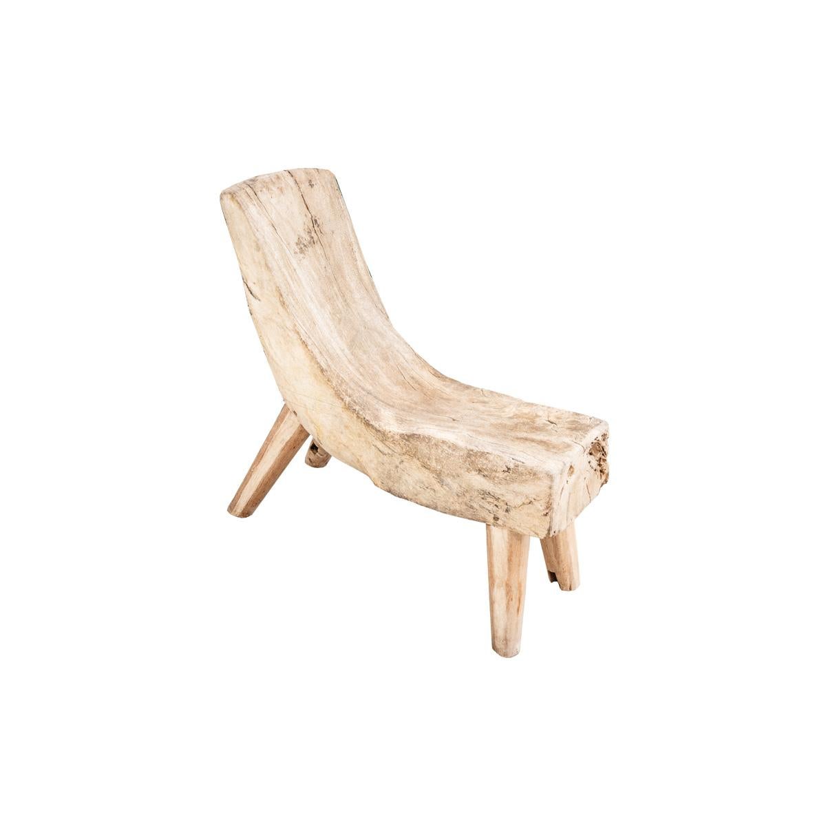 Solid wood is reclaimed and repurposed into an organic work of functional art. This chair features an incredibly unique silhouette while remaining comfortable. The reclaimed nature of the chair comes with its own characteristics and vintage patina