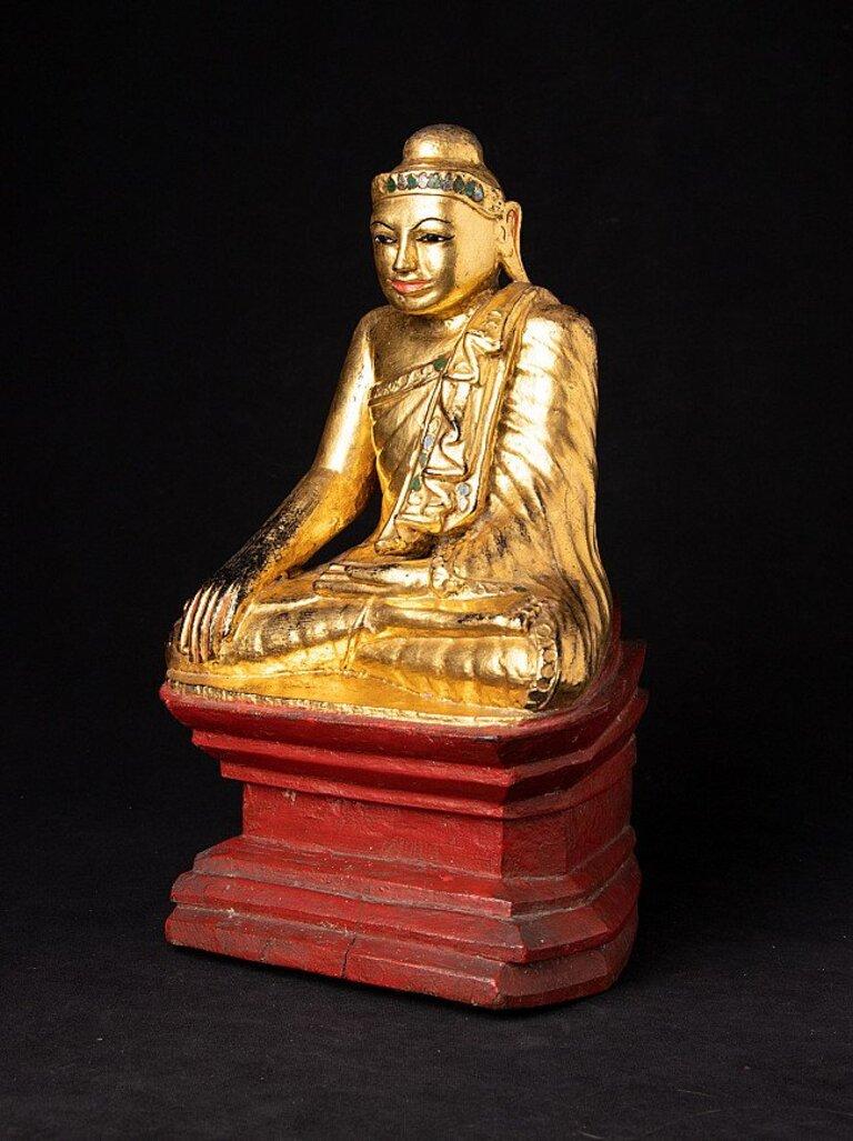 Material: wood
33,4 cm high 
19,5 cm wide and 17,5 cm deep
Weight: 1.832 kgs
Gilded with 24 krt. gold
Mandalay style
Bhumisparsha mudra
Originating from Burma
19th century.
 
