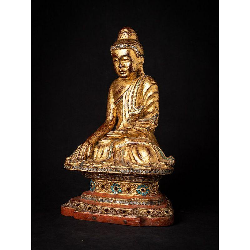 Material: wood
38 cm high 
24 cm wide and 17,5 cm deep
Weight: 2.941 kgs
Gilded with 24 krt. gold
Mandalay style
Bhumisparsha mudra
Originating from Burma
19th century.


