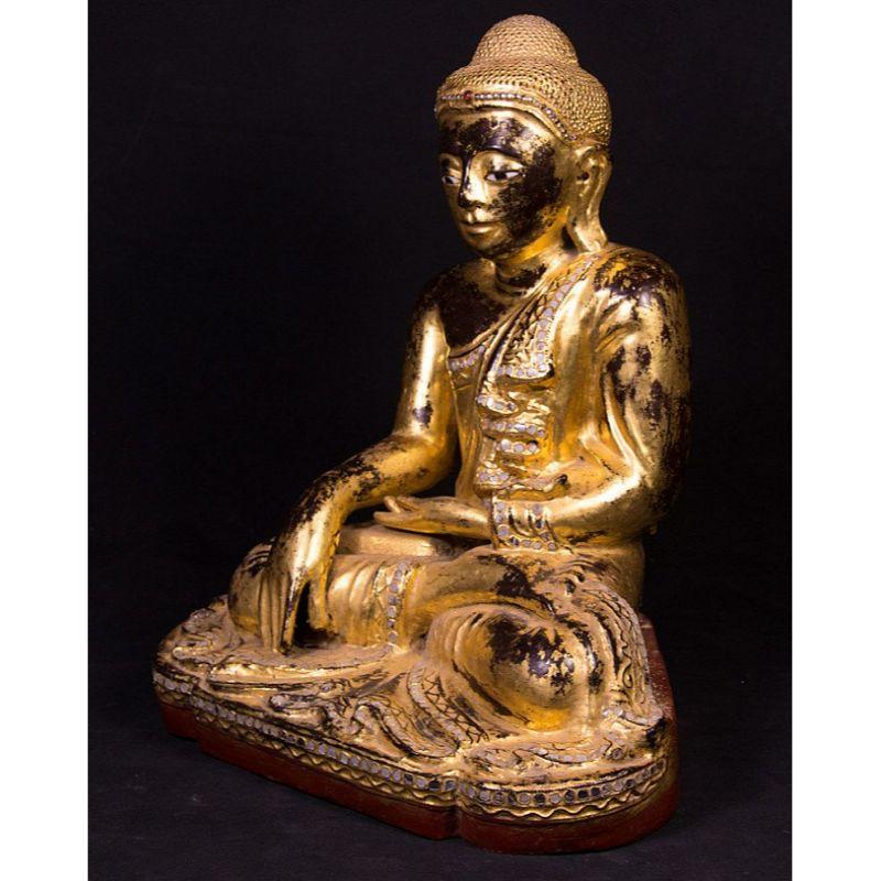 Material: wood
40 cm high 
32,5 cm wide and 24 cm deep
Weight: 4.788 kgs
Gilded with 24 krt. gold
Mandalay style
Bhumisparsha mudra
Originating from Burma
19th century
With inlayed eyes.
 