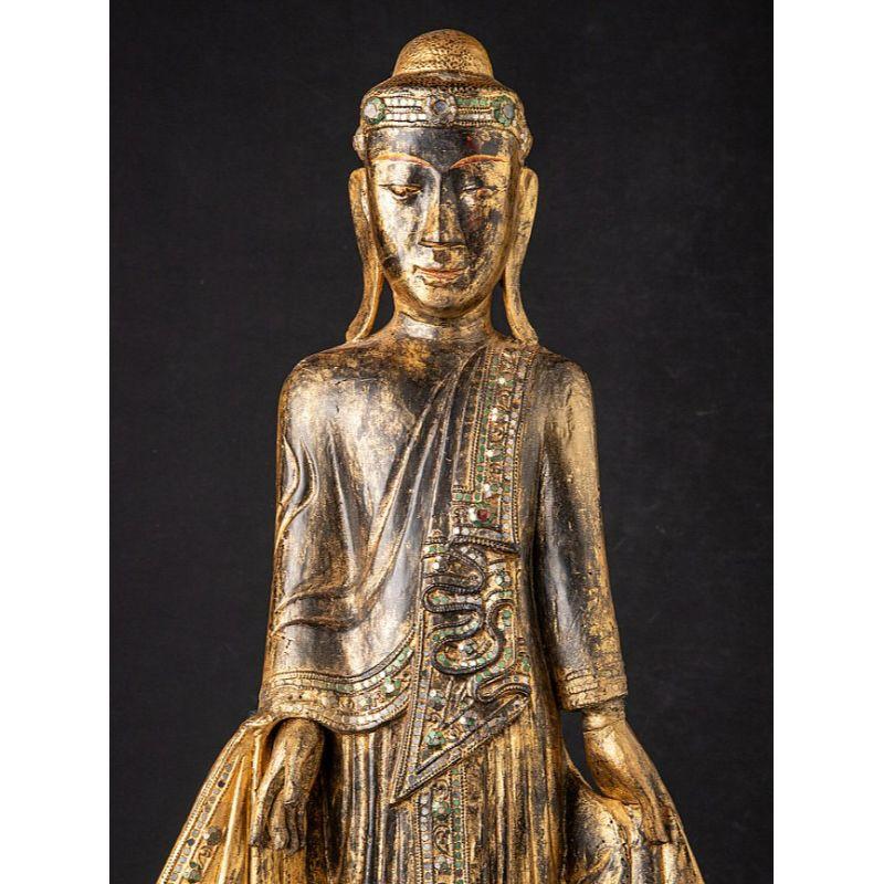 Material: wood
90 cm high 
39 cm wide and 24 cm deep
Weight: 5.8 kgs
With traces of the original 24 krt. gilding
Originating from Burma
19th century
The height of the black base is included and is 6.4 cm
With a beautiful and rare facial