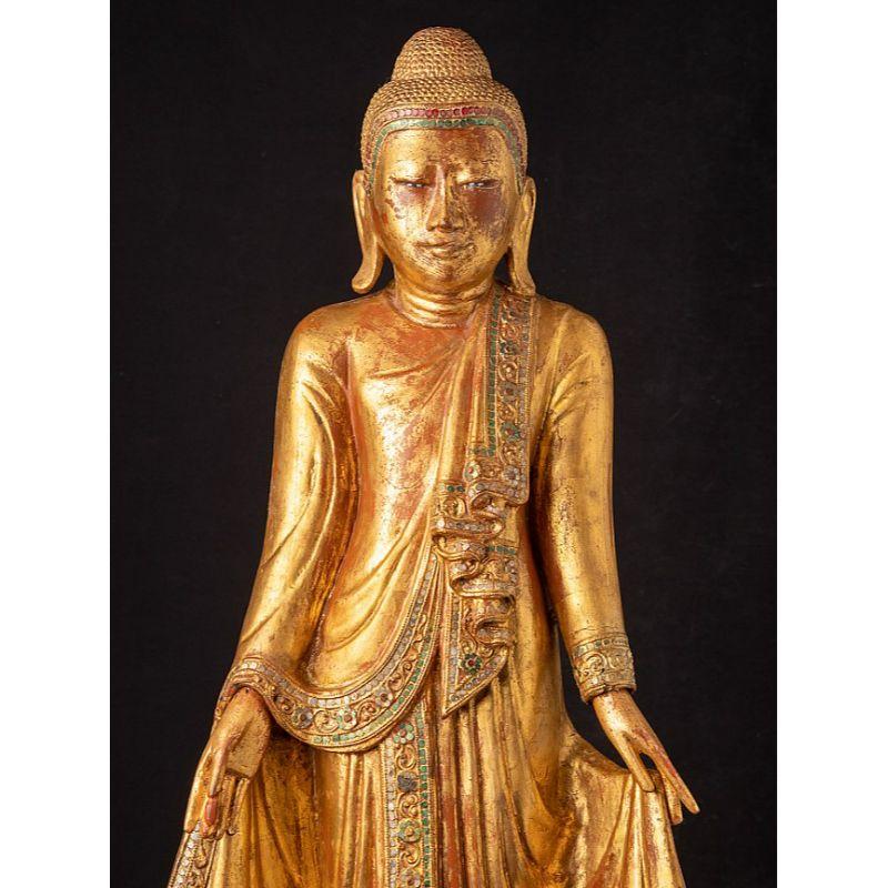 Material: wood
81,5 cm high 
34,5 cm wide and 20 cm deep
Weight: 6.624 kgs
Gilded with 24 krt. gold
Mandalay style
Originating from Burma
19th century
With inlayed eye.
 