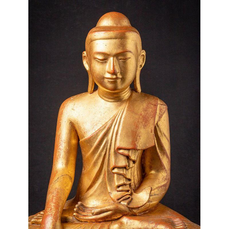 Material: wood
68 cm high 
58 cm wide and 31 cm deep
Weight: 16.7 kgs
Gilded with 24 krt. gold
Mandalay style
Bhumisparsha mudra
Originating from Burma
19th century - early Mandalay period.

