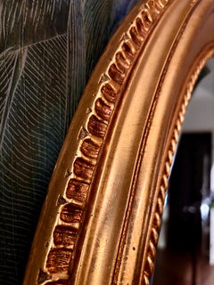 Antique wooden mirror with gilded frame