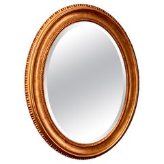 Antique wooden mirror with gilded frame