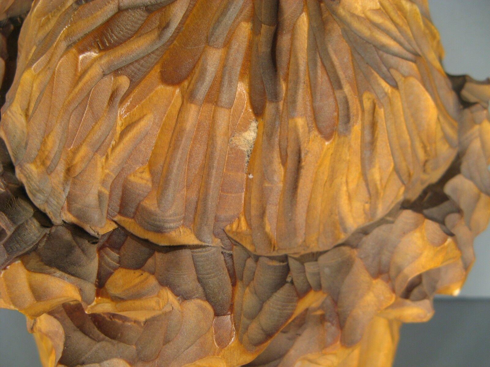 This captivating antique wooden sculpture of Christ's head with a crown of thorns, dating back to the second half of the 20th century, exudes a sense of spirituality and artistry, adding a touch of reverence and contemplation to any sacred space or